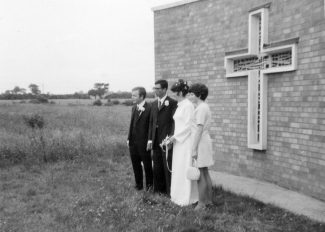 Ann Oliffs wedding with her sister Yvonne showing the fields at the back of the church.