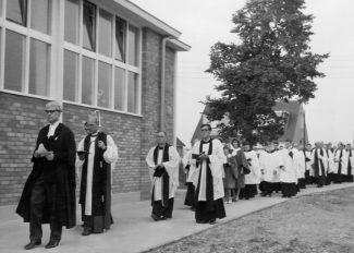 Procession into church for the dedication, Dawn White in front of Ina Osborne with Stan Osborne behind.