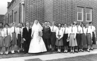 Marriage of Ms McConnell (music teacher). To the right of Ms McConnell is Mr Melvin Beddow (head of the music department). The King John School Choir sang at this wedding in 1958 | Ann Morrison collection