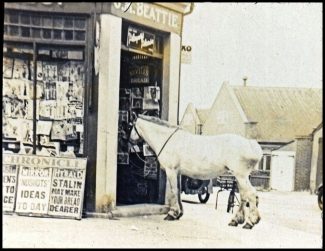 Changing Times - the newsagents corner shop with the club in the background Changing Times - the newsagents corner shop with the club in the background