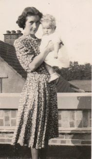 Mum holding Janice - standing on the flat roof | Janice Jiggens