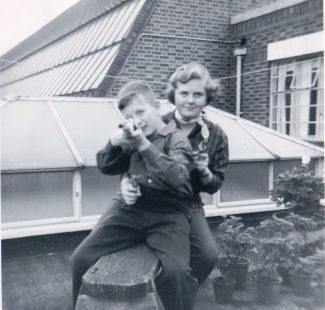 Janice and John playing on the flat roof | Janice Jiggens