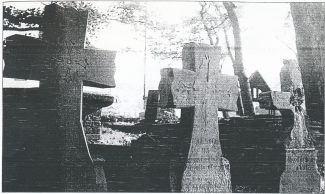 John Cook's grave (centre) with his sister, left and mother, right