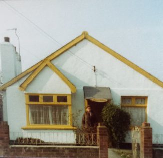 Front view of the whitewashed 'Manor Cottage' in 1974 | Pamela-Jeanetta Bird Gaines