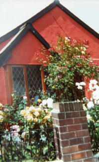 Front view of 'Manor Cottage' painted Cinnabar after the extension was added in 1985 | Pamela-Jeanetta Bird Gaines