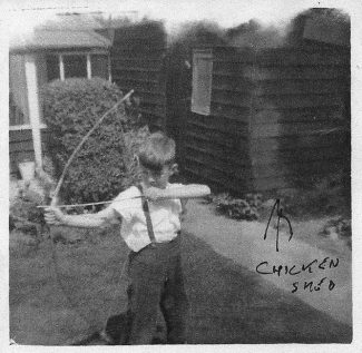 Playing in the garden with my bow and arrows in 1954 | John Garnham