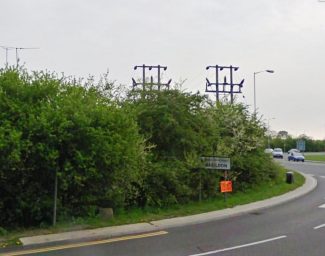 The base just visible between the post far left and the orange sign. | Photo before current road layout changes were commenced.