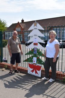 Organizers Janice Gray and Dave Cowan with the Christmas lights fundraising tree indicator outside Benfleet School.  June 2018